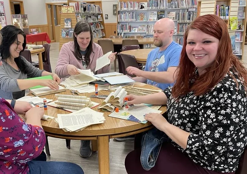 group doing a craft in the library